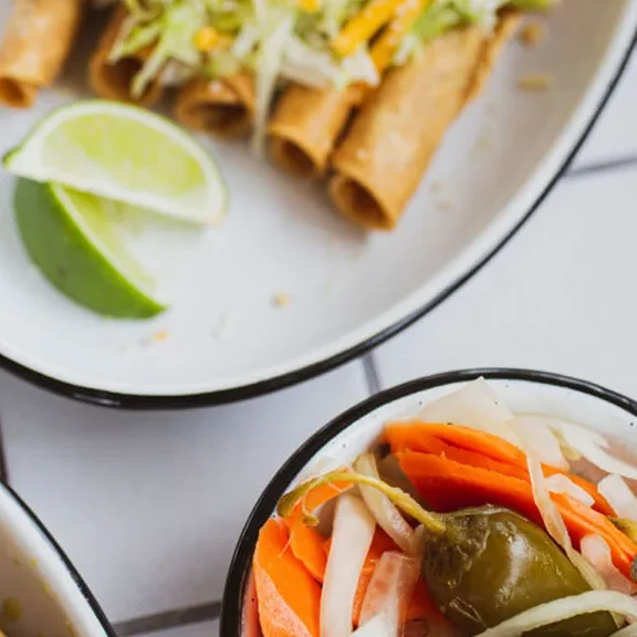 Rolled taquitos with lime at Roberto’s Taco Shop