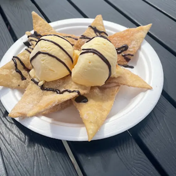 Cinnamon sugar tortilla chips with ice cream and chocolate drizzle dessert