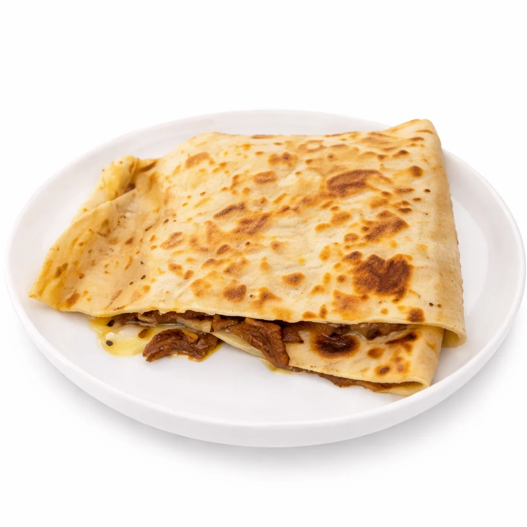 Breakfast burrito filled with scrambled eggs and breakfast ingredients